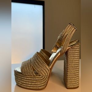 Gold rope like material, strappy platforms. Such a pretty summer shoe.